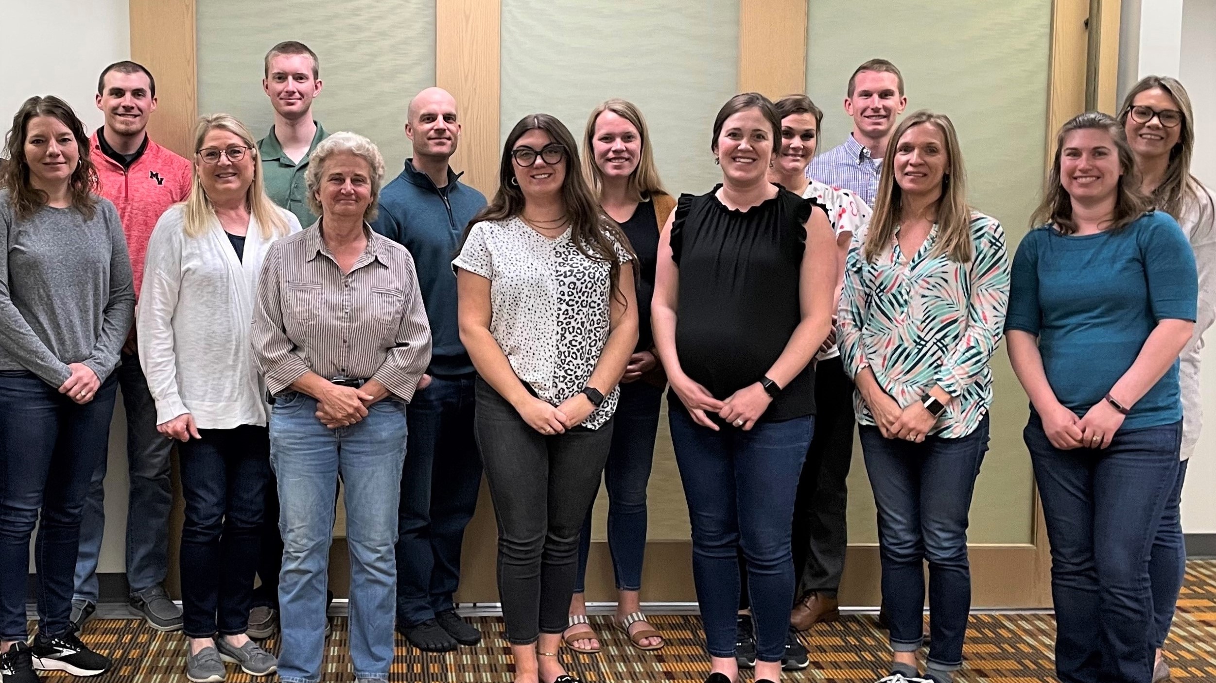 A group of 14 Celina Insurance Group employees pose after completing first aid, CPR and AED training.