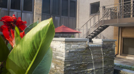 Photo of fountain and flowers in the Celina Insurance Group courtyard.